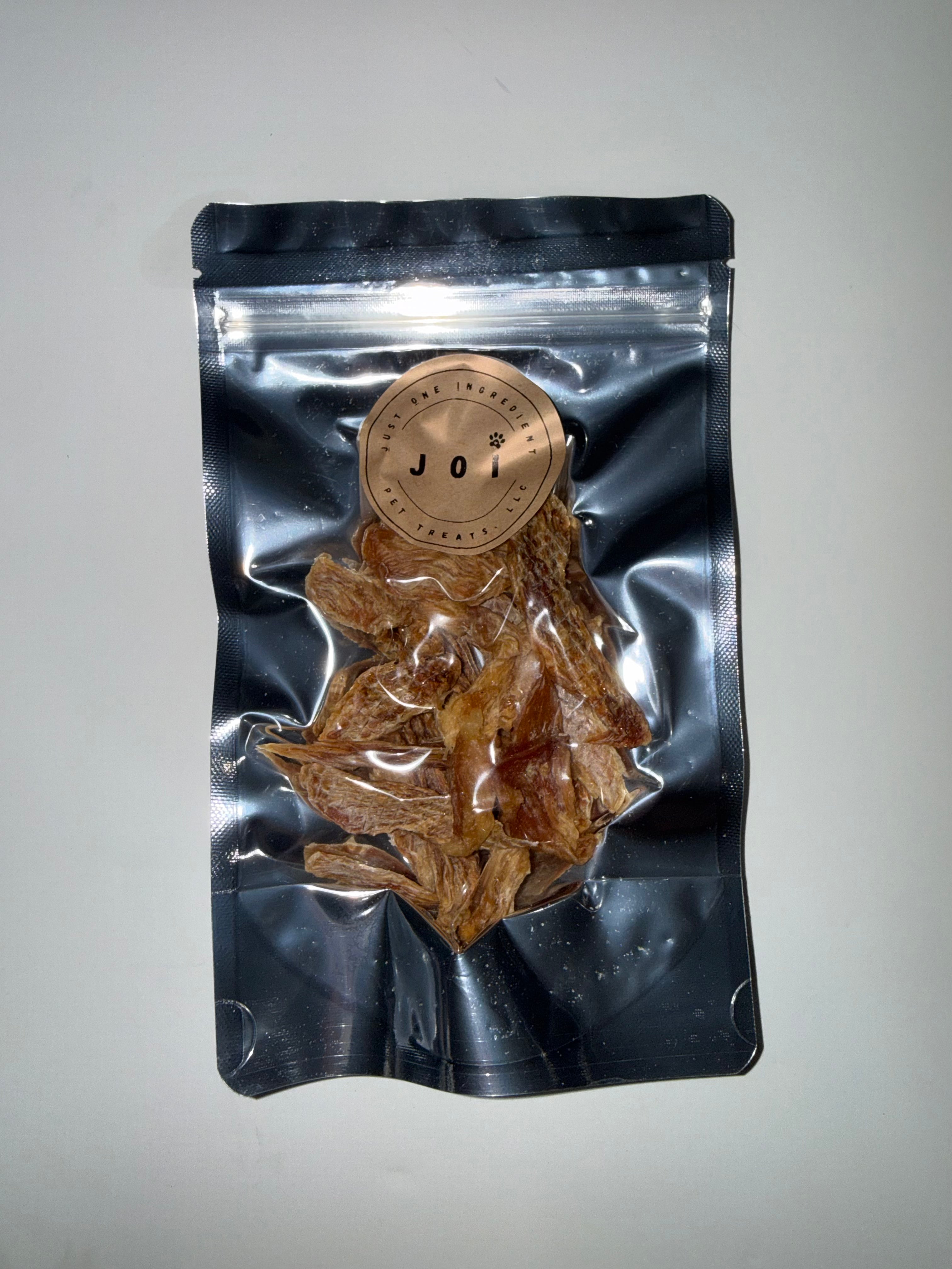 Packaged chicken breast treats with JOI label on a white background