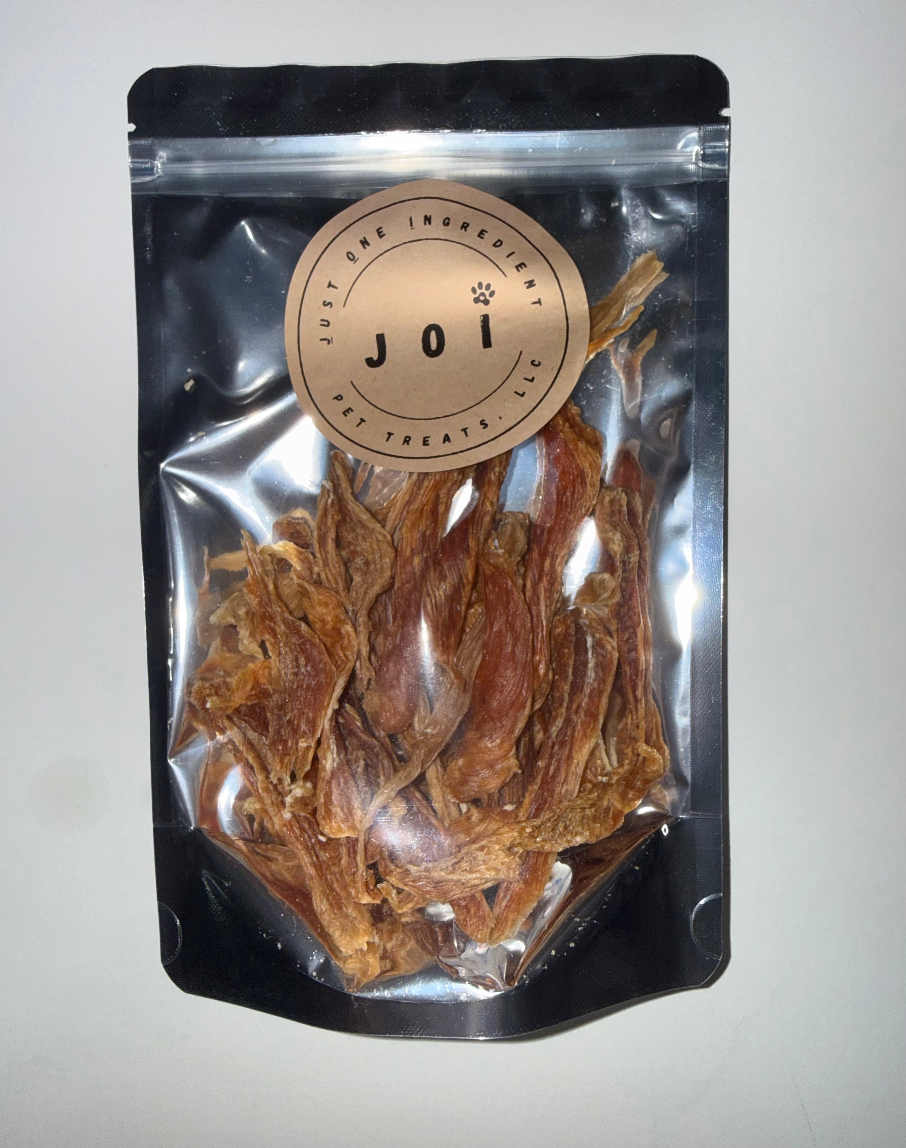 Packaged chicken breast treats with JOI label on a white background