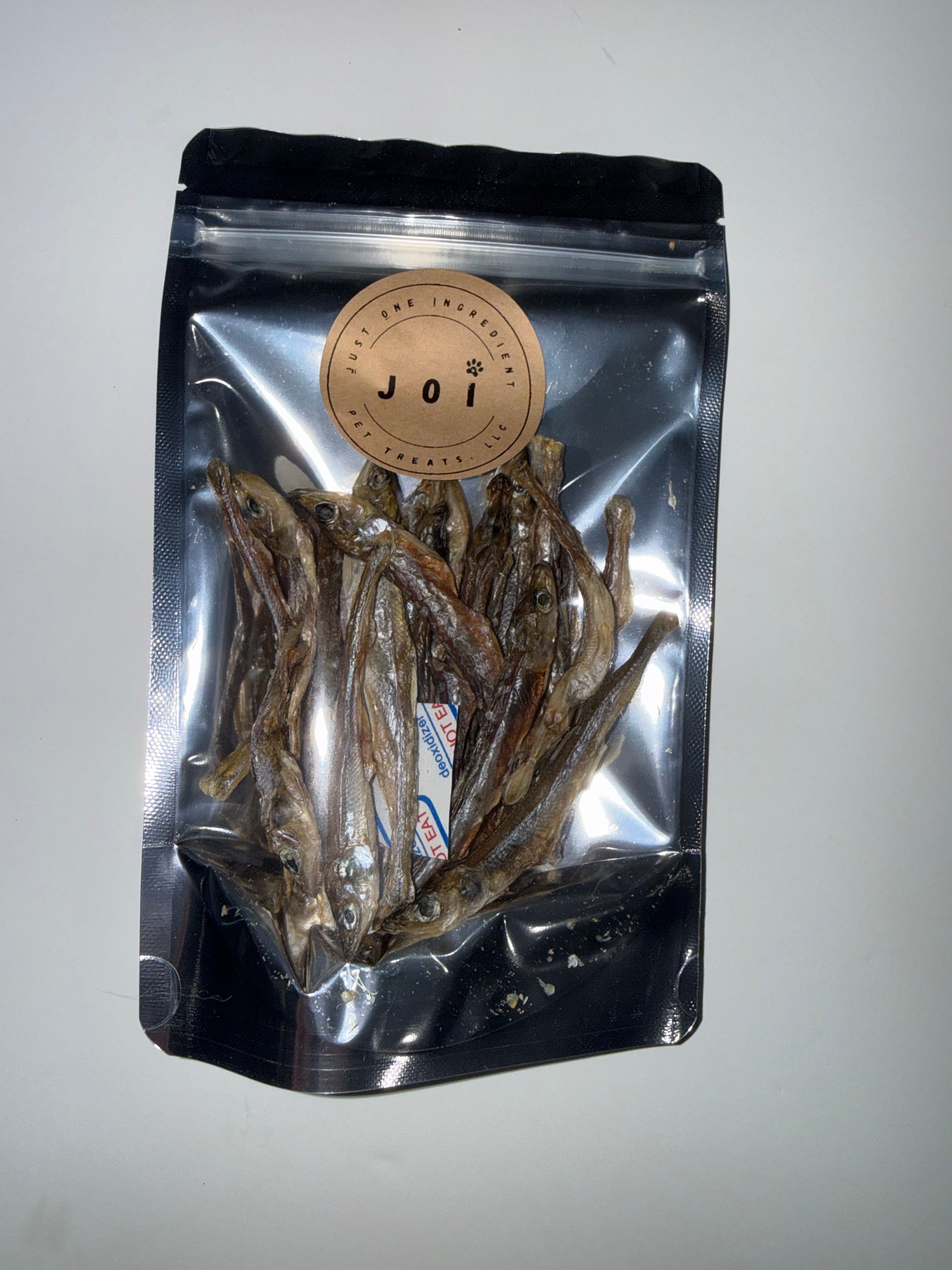Packaged small smelt treats with JOI label on a white background