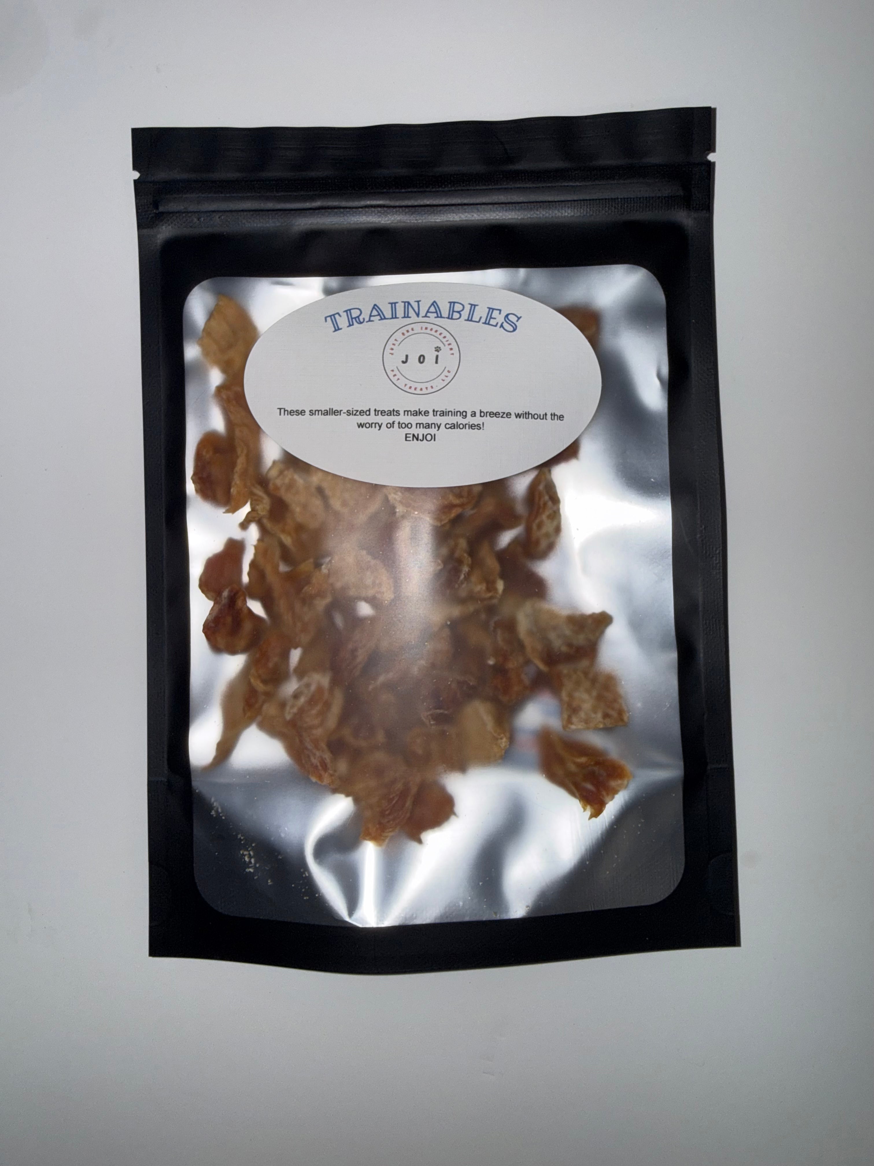 Packaged trainables chicken breast treats with JOI label on a white background