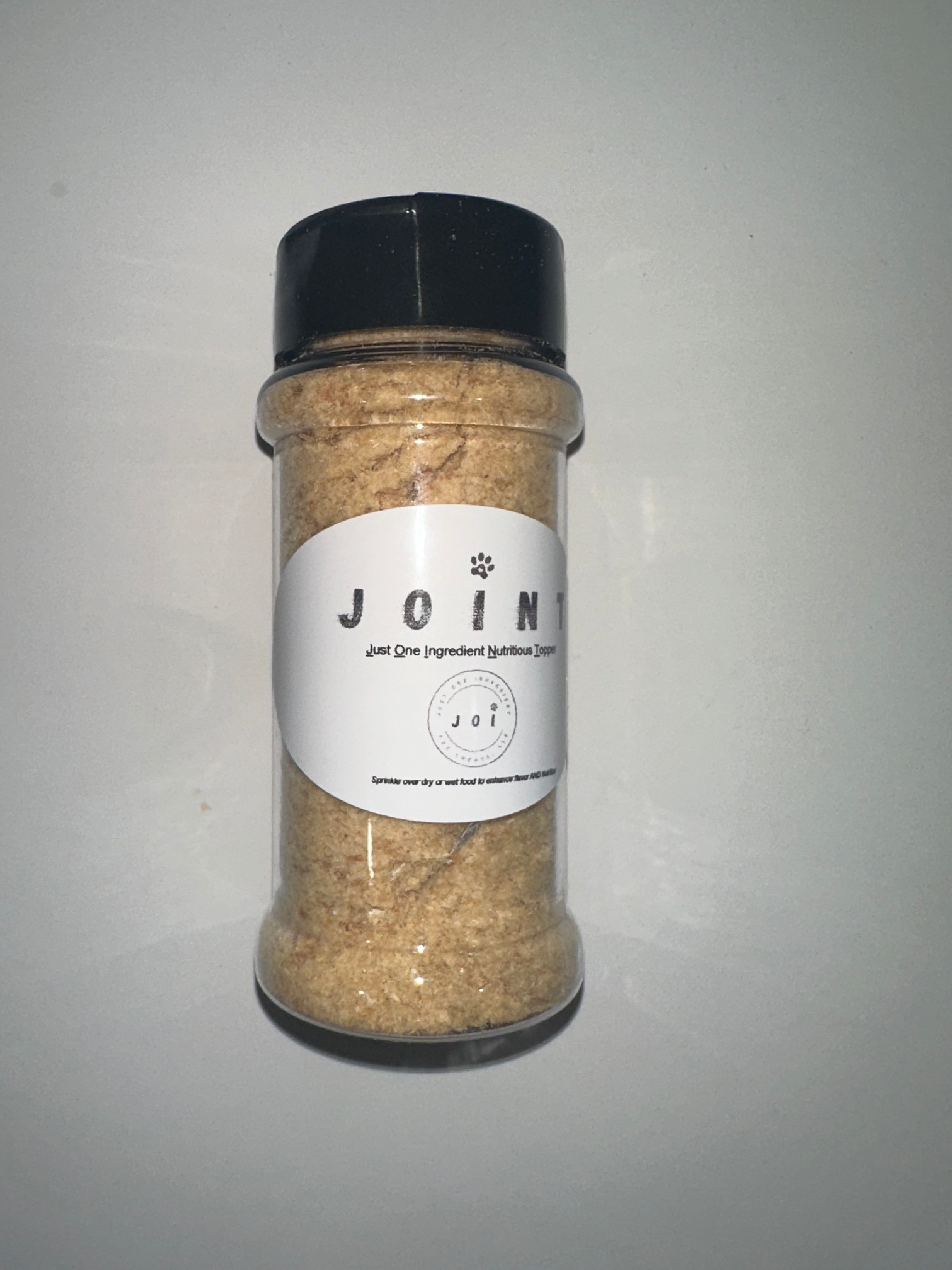 Bottle of 'JOINT' with a label on a gray background
